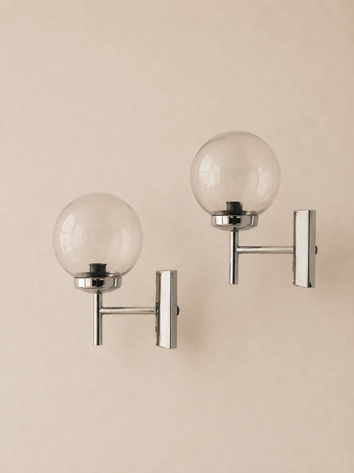French 1970s chrome and glass wall lights.