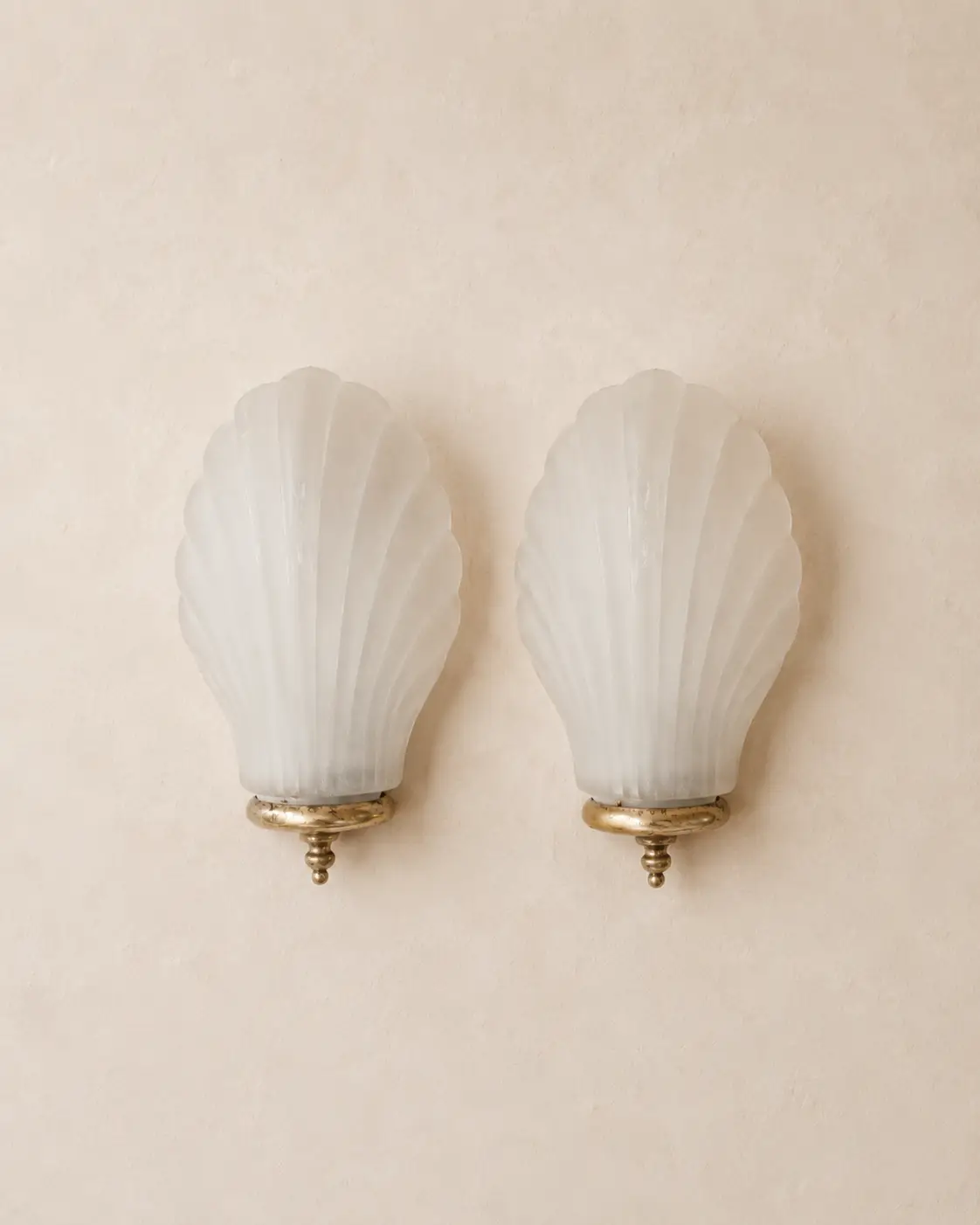 Vintage frosted glass shell wall sconces.