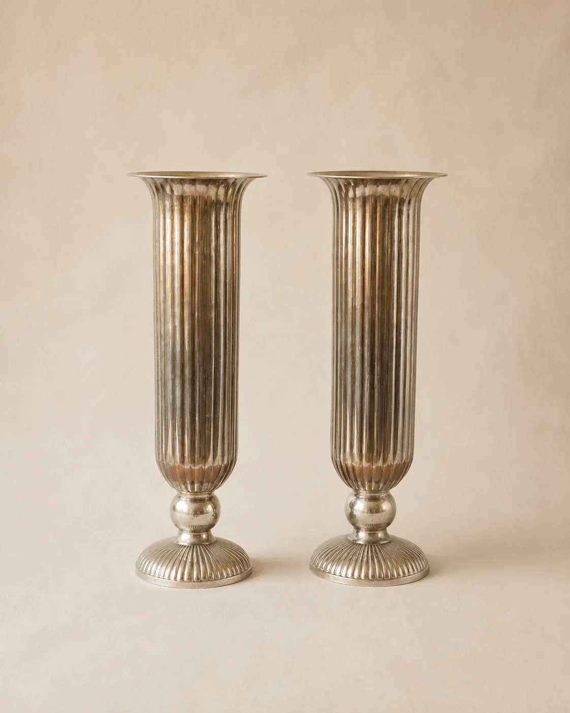 Large silver coated decorative vases.